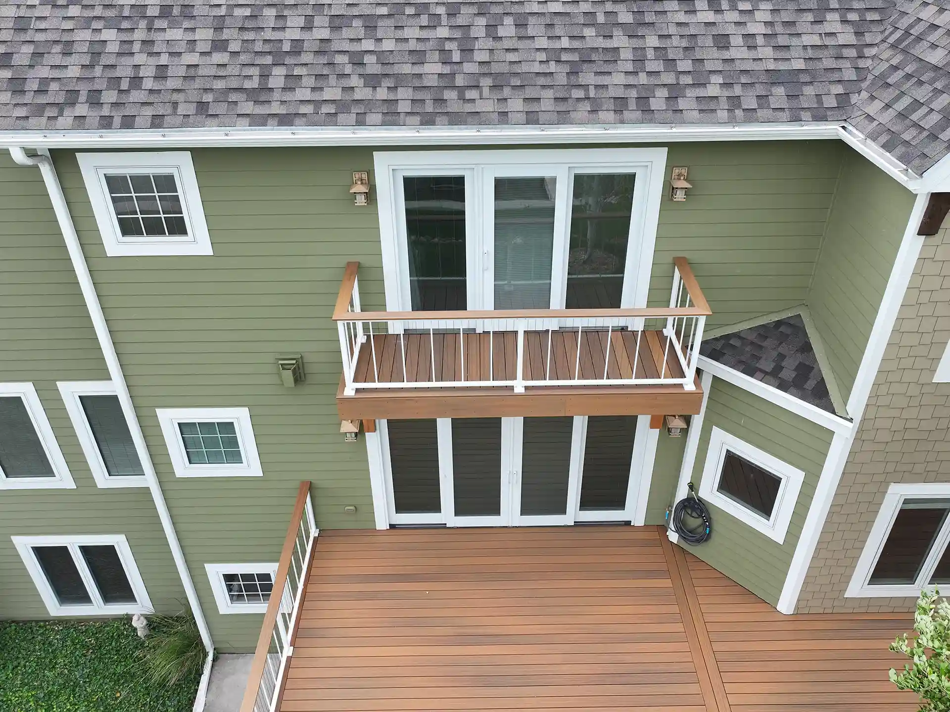Composite deck with a wood-like texture - Composite deck boards vs wood decking - Deck Building company near me