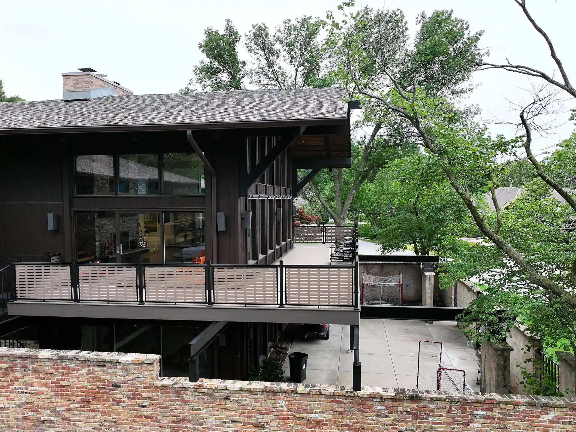 photo of elevated wraparound deck - Deck Building Company in Elkhorn Nebraska