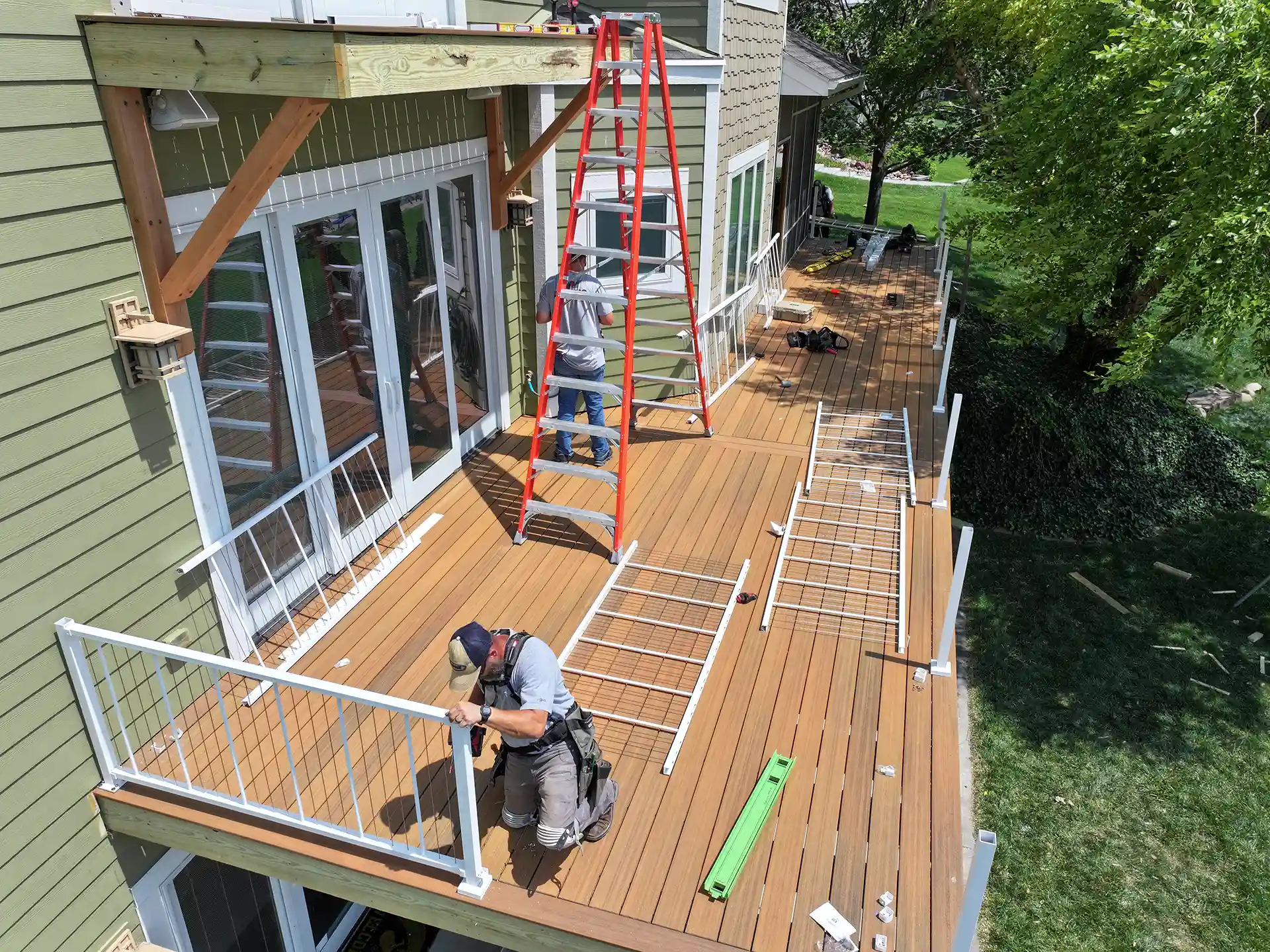 Local deck builders from Wymore Deck & Fence building a new deck and second story deck