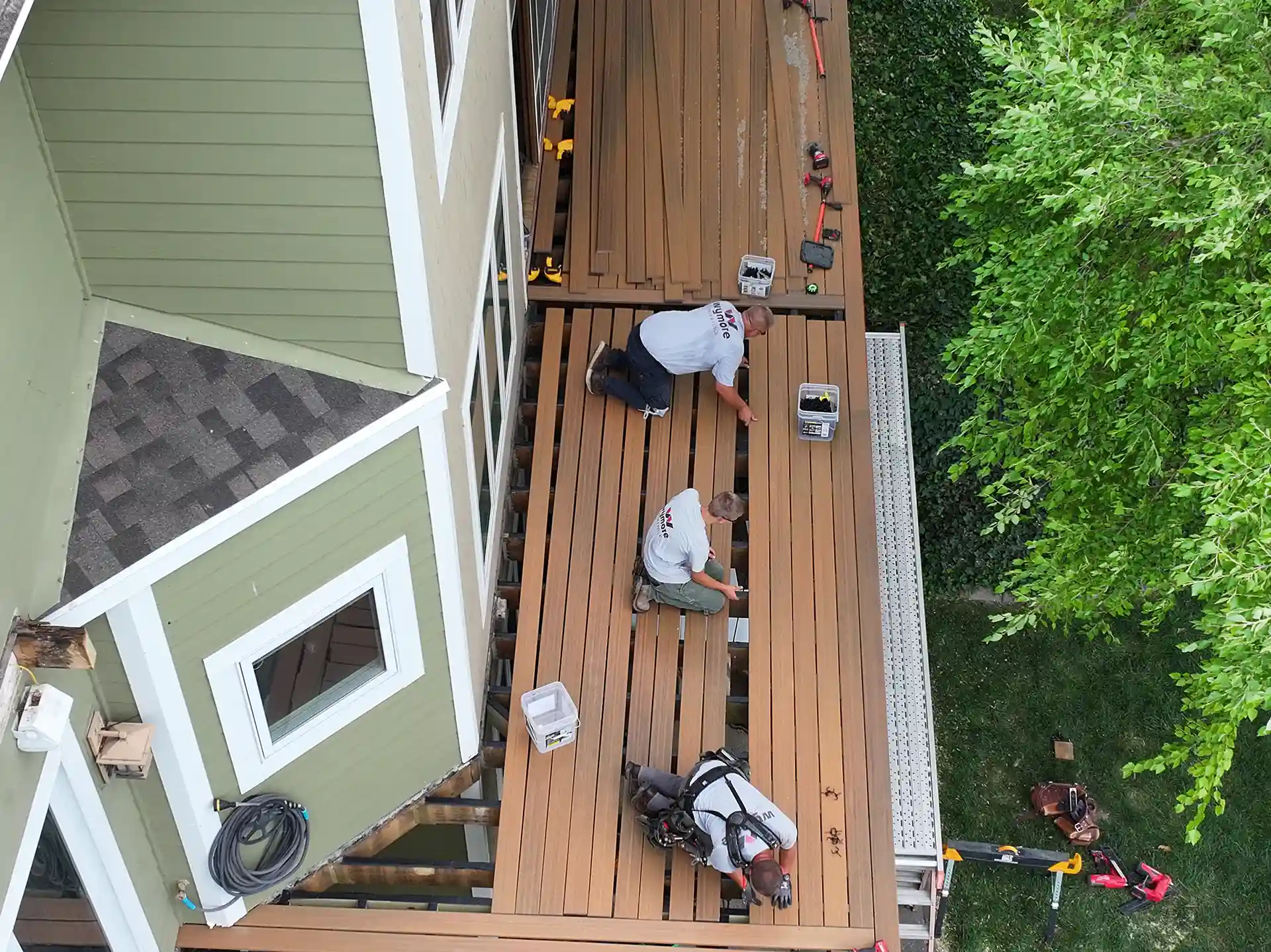Photo of a local deck builder crew installing composite deck boards