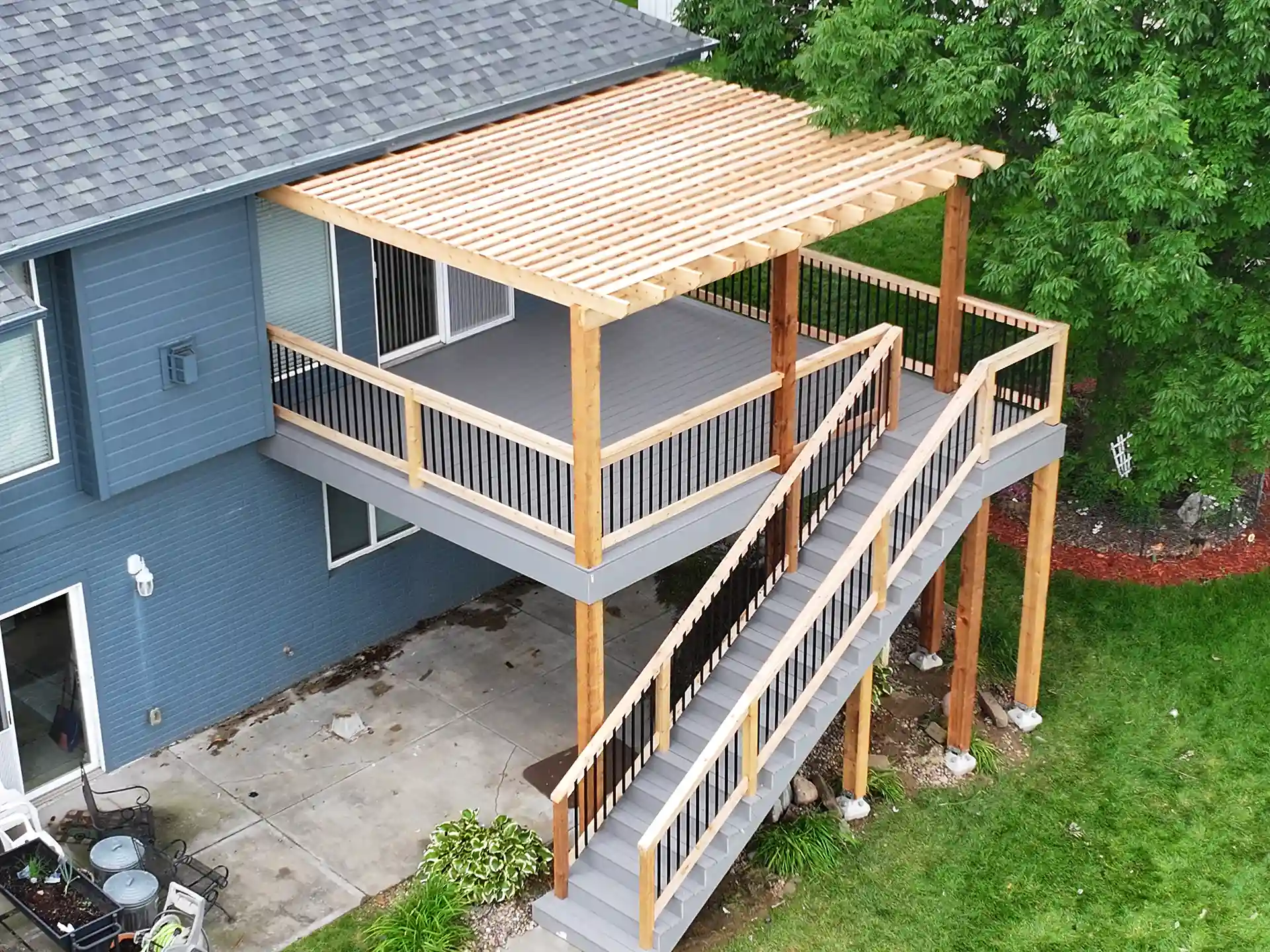 traditional wooden pergola on an elevated deck - pergola vs gazebo vs pavilion​ - How to choose for my home