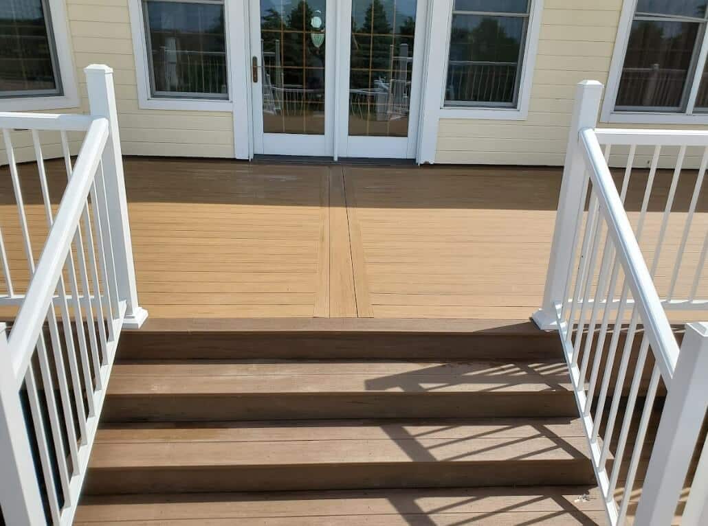 photo of a composite deck with deck railing and deck steps - Fiberon Decking Contractors in West Omaha, Nebraska